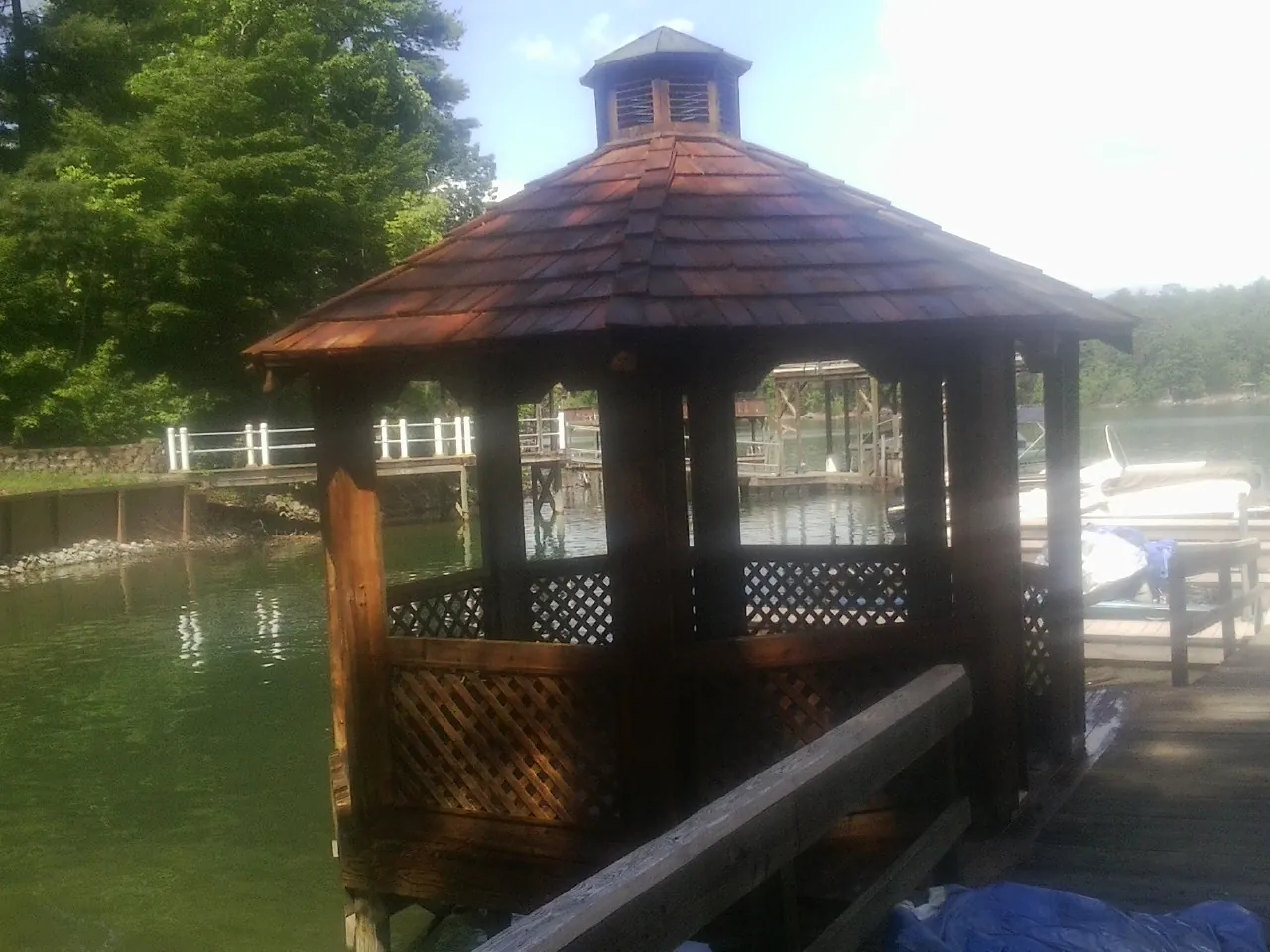 Cedar shake gazebo roof rebuilt on a lake dock in Cowan